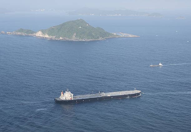 -A photograph taken from the town of Al Jeer in the northern emirate of Ras Al Khaimah shows a tanker passing through the waters of the Strait of Hormuz on February 25, 2026.